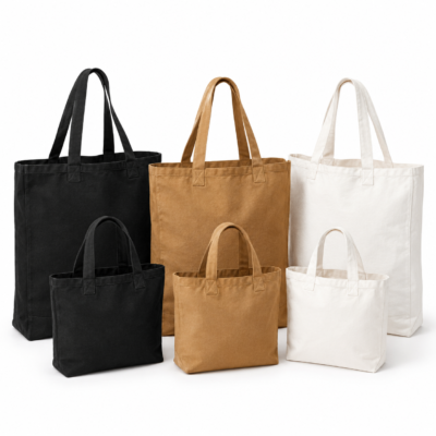 Small and large reusable fabric tote bags in black, brown, and white.